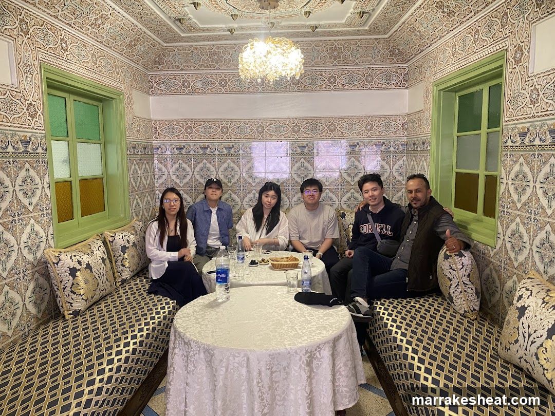 Group photo in ornate Moroccan-style room