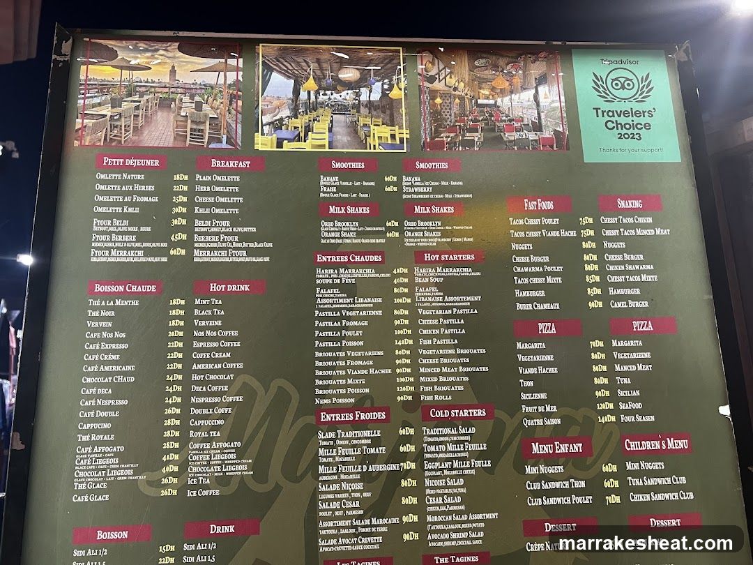 A large illuminated menu board displaying various food and drink categories including Petit Déjeuner, Breakfast, Smoothies, Milk Shakes, Entrées Chaudes, Hot Drink, Boisson Chaude, Drink, Fat Food, Snacking, Pizza, Children's Menu, Dessert, and Menu Enfant. The board features three photos of the restaurant interior at the top and includes a 'Travelers' Choice 2023' award badge in the upper right corner.